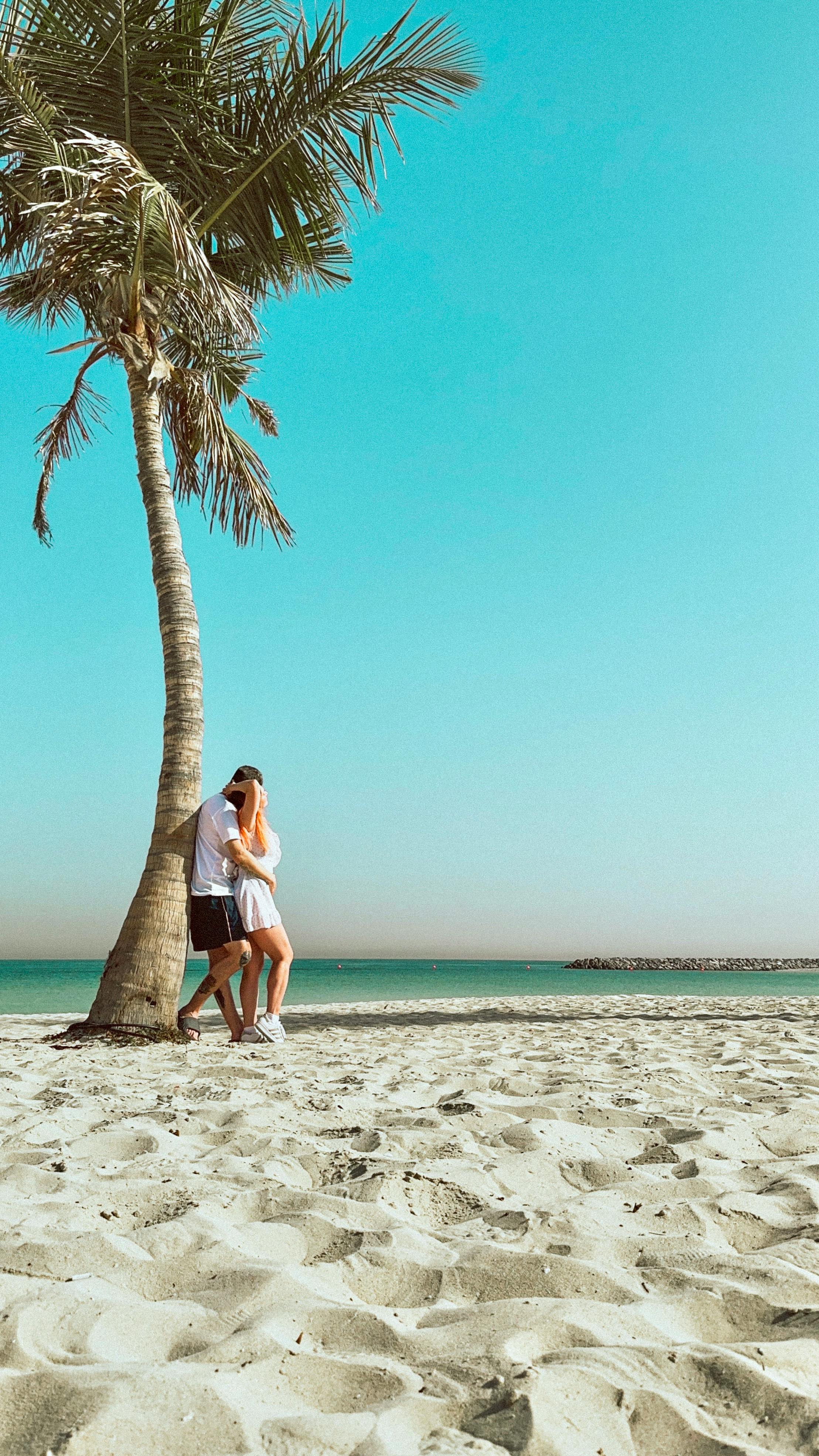 Couple walking together along the shoreline