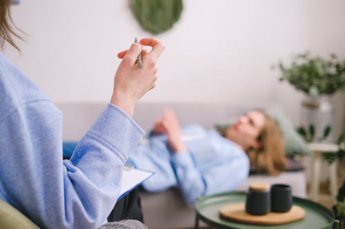 Couple holding hands during a couples counseling session